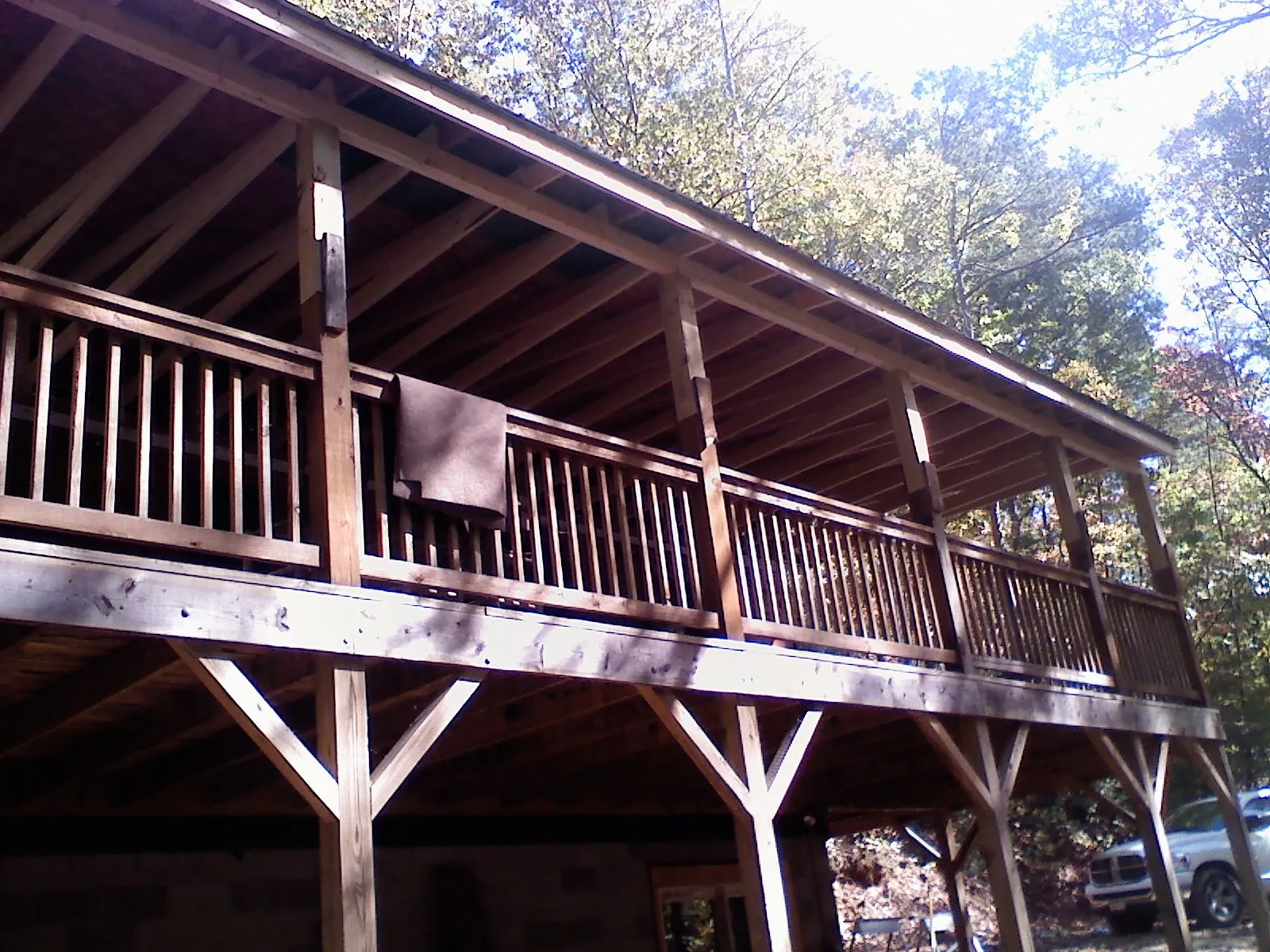 Timber framing under a new elevated porch and deck — Roof Leak Repair in East Norwich by Roofing Brothers